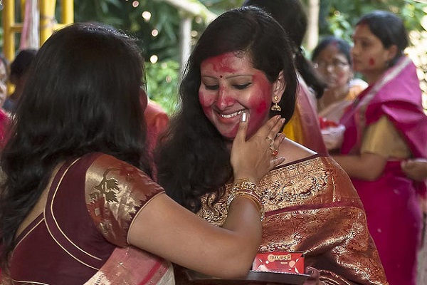 What's the Significance of the Red Powder Hindu Women Wear on Their Heads?